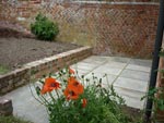 A raised bed and patio