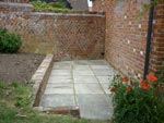 A raised bed and patio